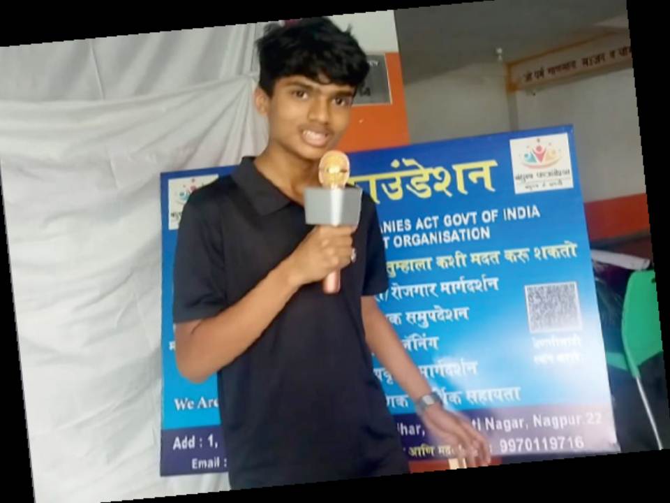 A young Bandhutva volunteer speaking at a community event